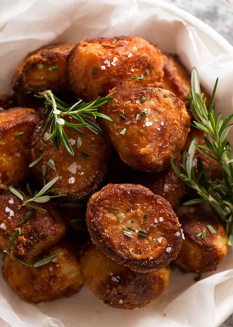 Duck Fat Potatoes in a bowl garnished with sea salt flakes and rosemary