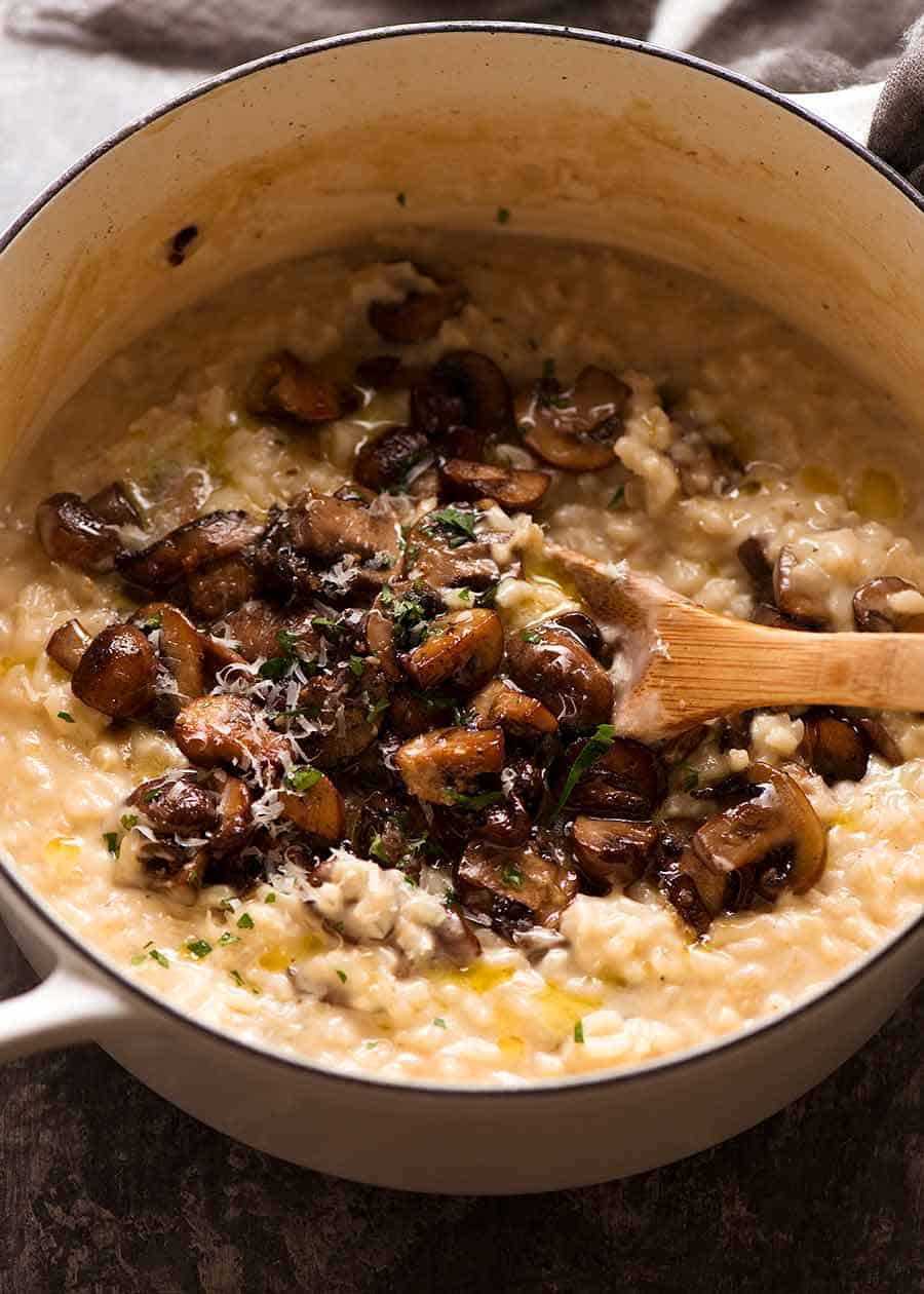 Pot of Mushroom Risotto in a white cast iron pot, fresh off the stove