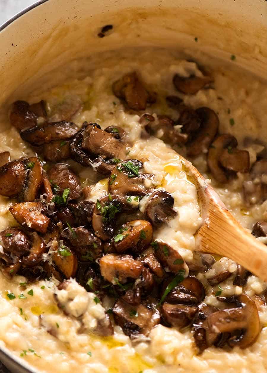 Close up of Mushroom Risotto in a white cast iron pot, fresh off the stove