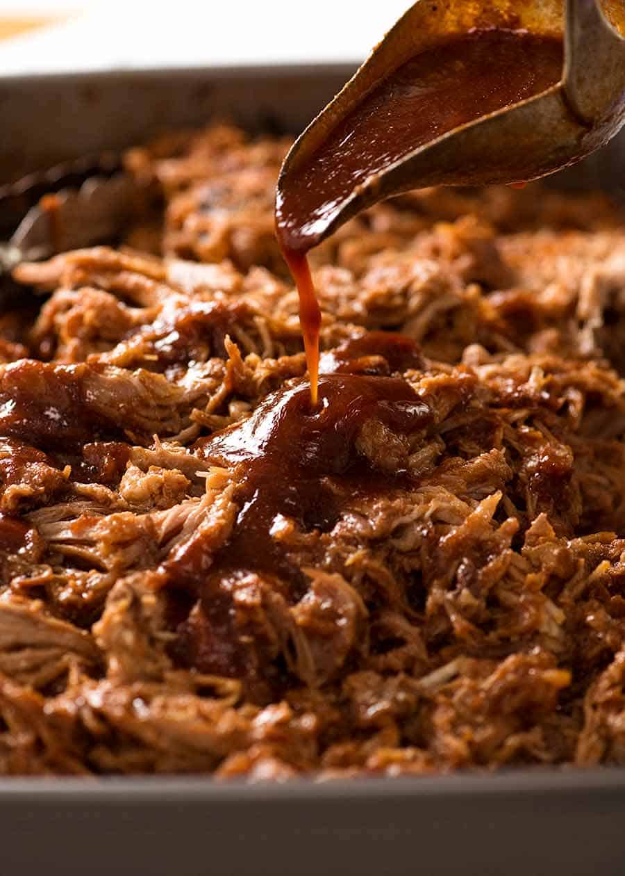 Pour homemade barbecue sauce over pulled pork