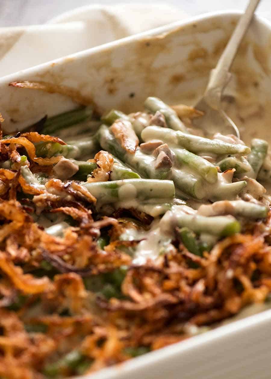 Close up of Green Bean Casserole in a white casserole dish, ready to be served
