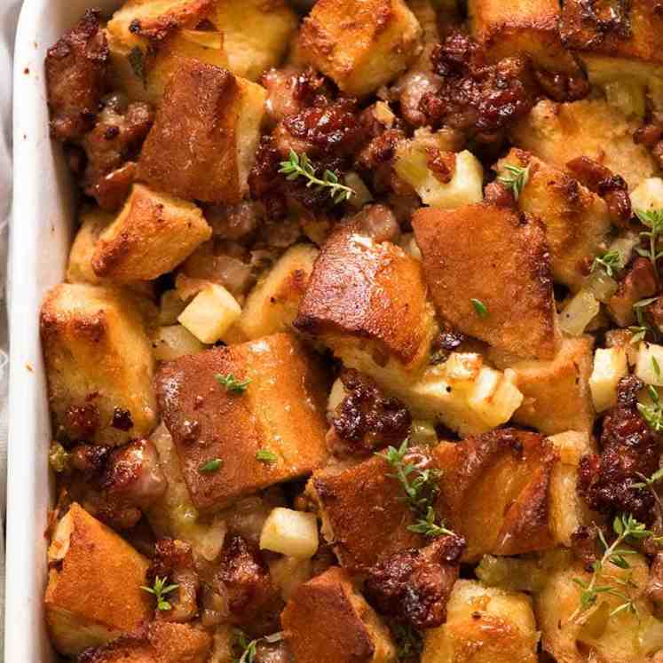 Close up of Sausage Stuffing recipe in a white baking dish, fresh out of the oven ready to be served