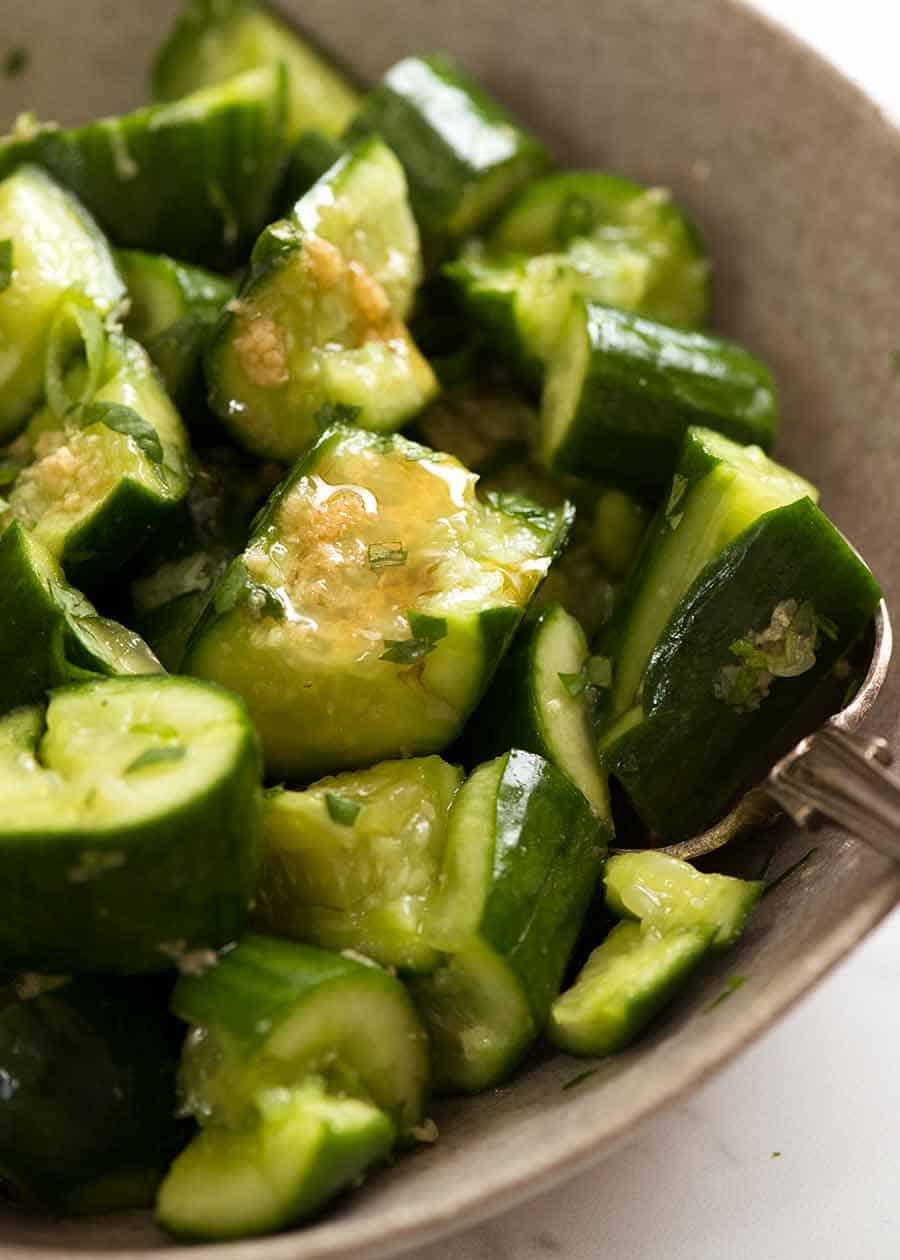 Close up of Smashed Cucumbers in a rustic bowl, ready to be served