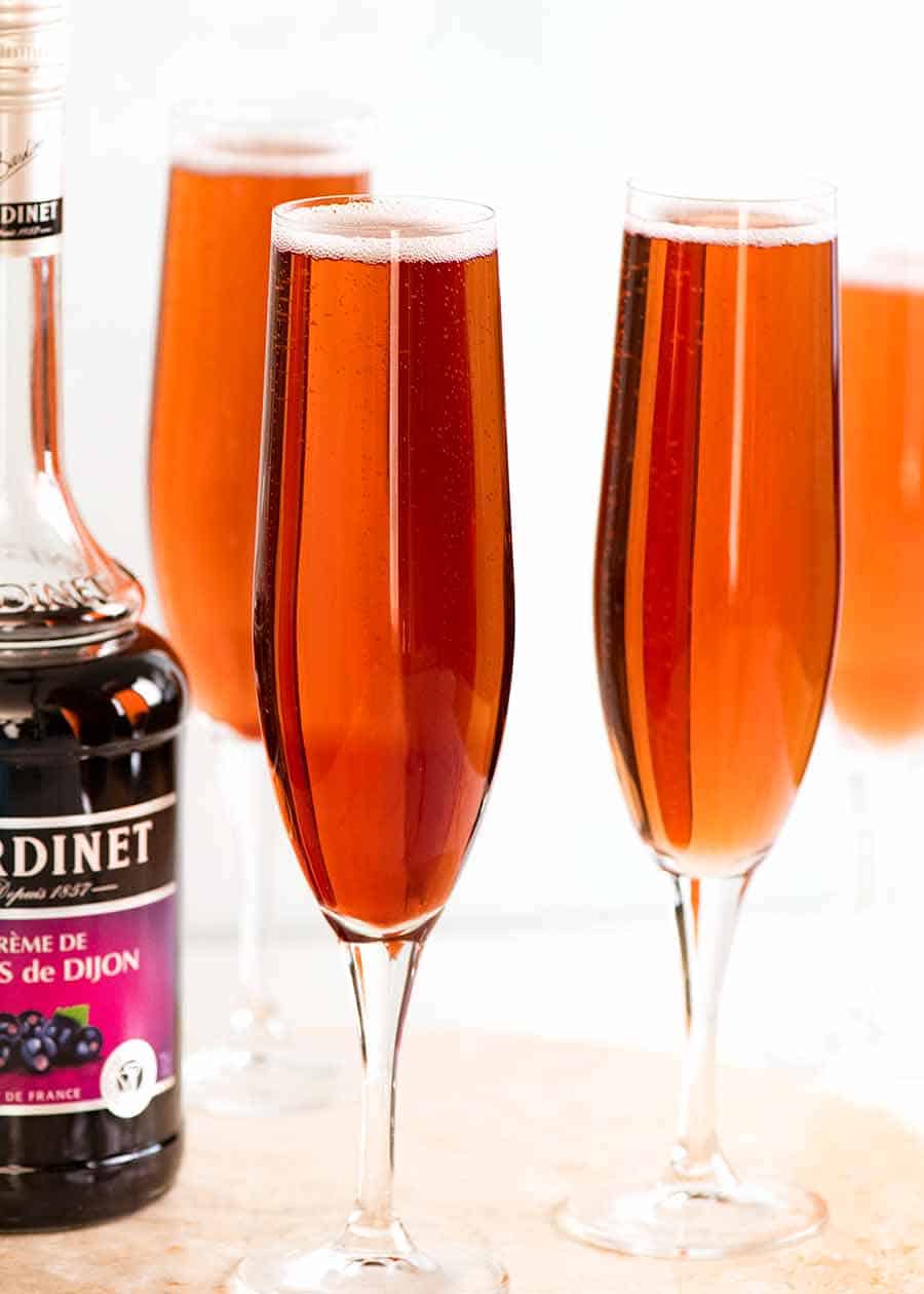 Kir Royale (French champagne cocktails) in champagne glasses, ready to be served