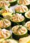 Close up of Cucumber Canapés topped with smoked salmon mousse garnished with dill