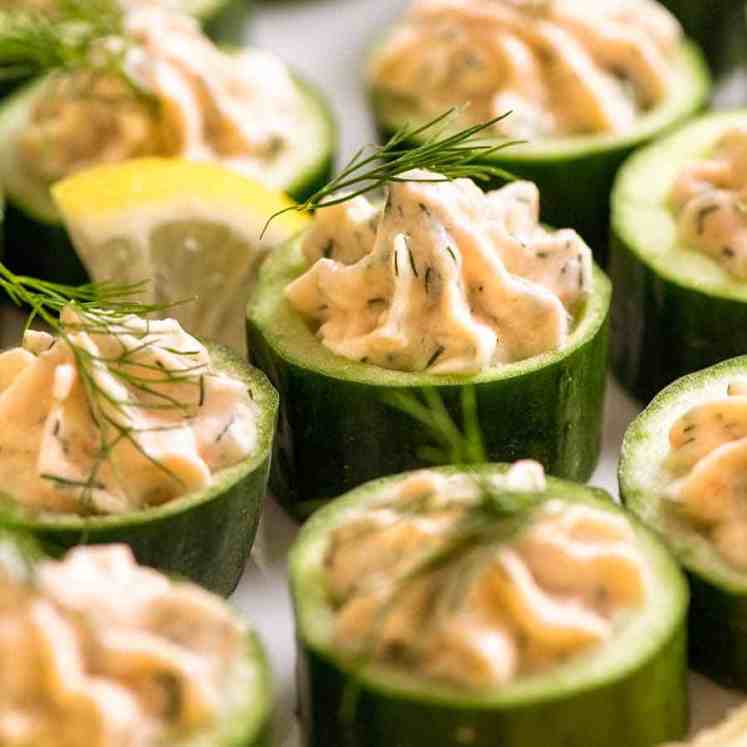 Close up of Cucumber Canapés topped with smoked salmon mousse garnished with dill