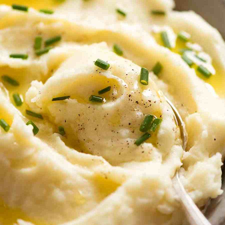 Close up of spoon scooping up Mashed Potato