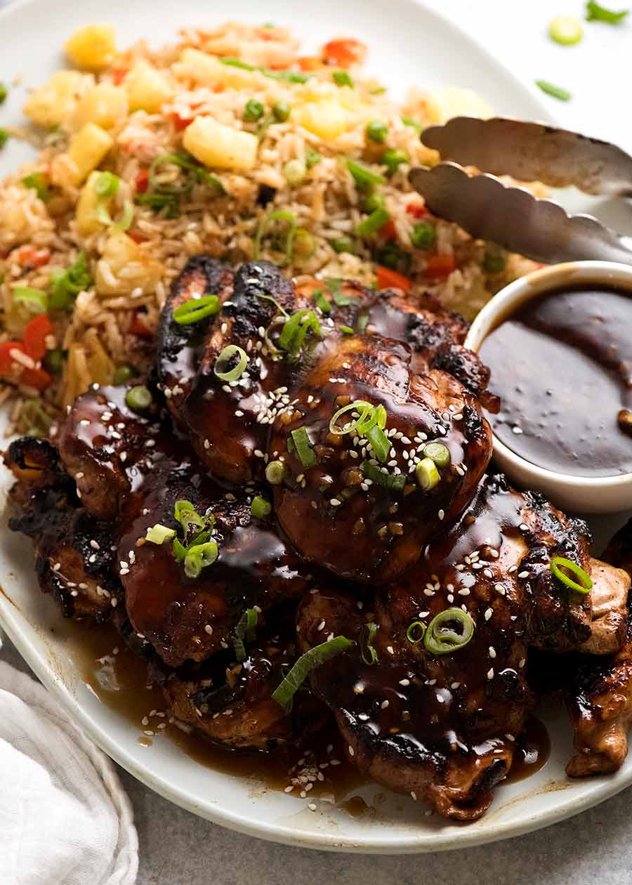 Plate of honey soy garlic chicken with a side of pineapple fried rice