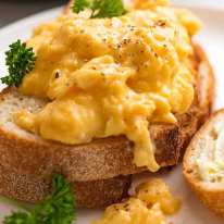 Close up of soft Scrambled Eggs on toast