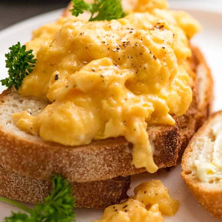 Close up of soft Scrambled Eggs on toast