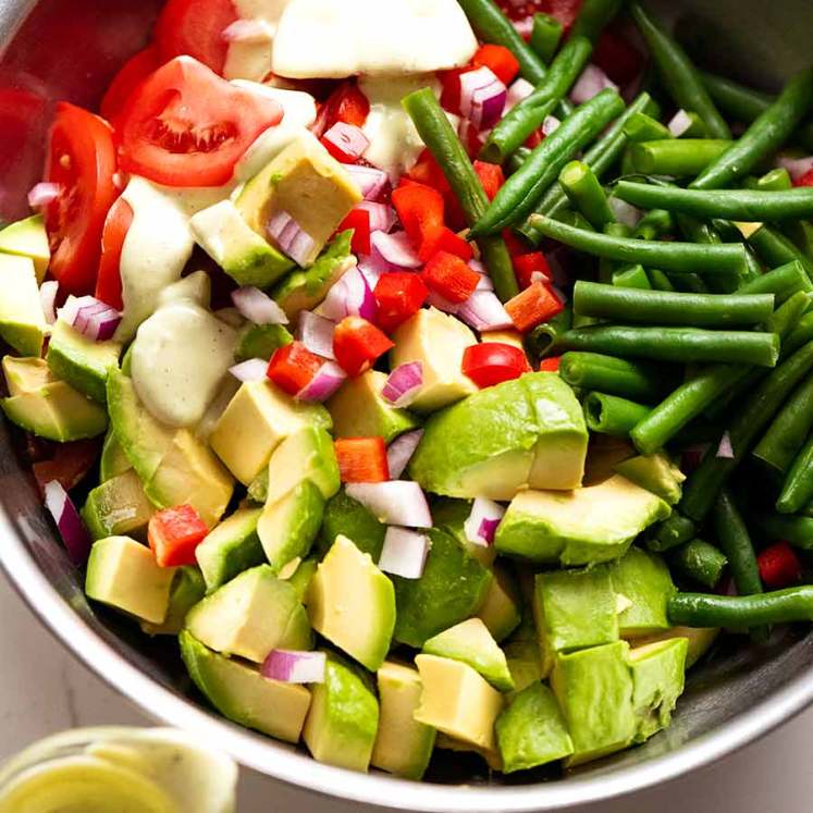 Bowl of Green Bean Avocado Salad with Avocado Dressing ready to be tossed