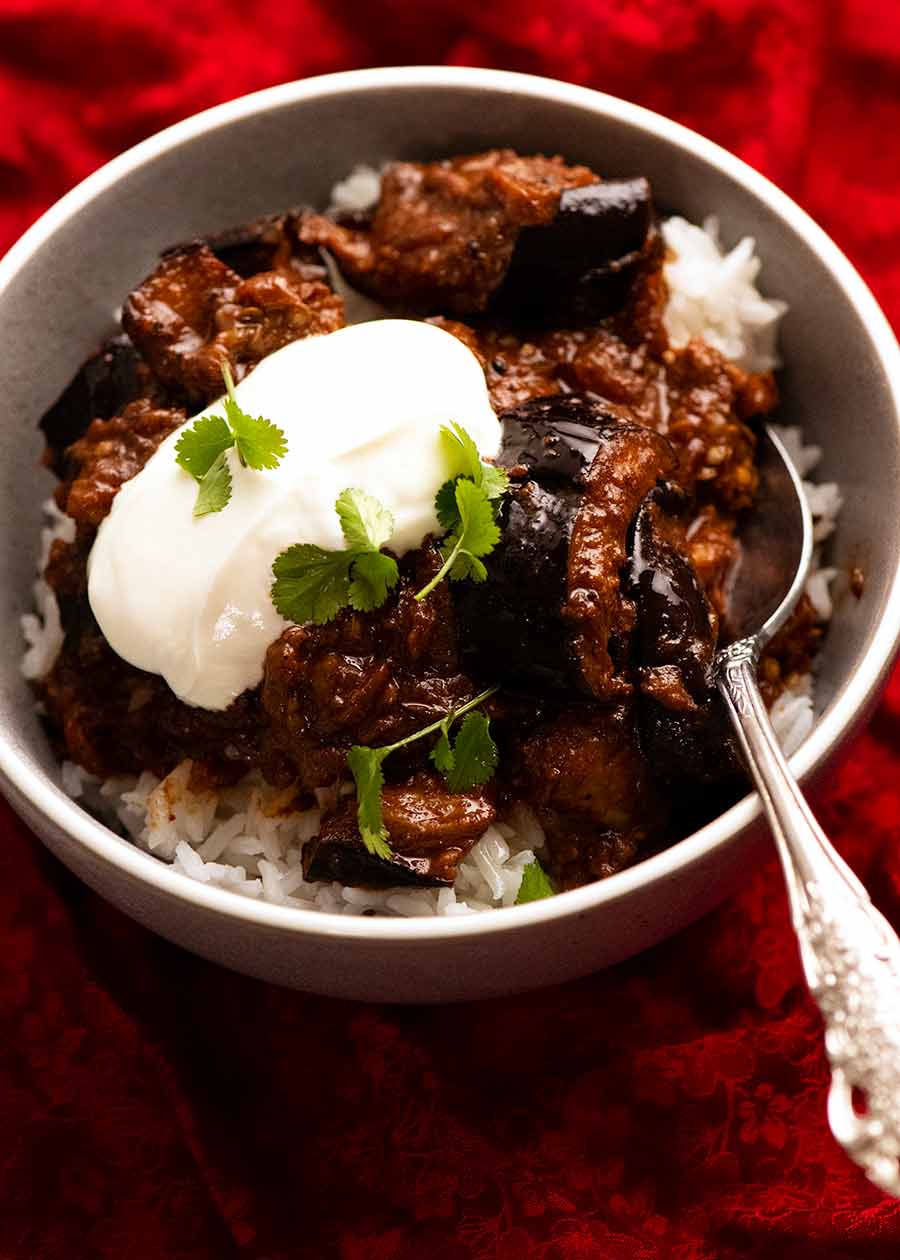 Bowl of Indian eggplant curry on rice