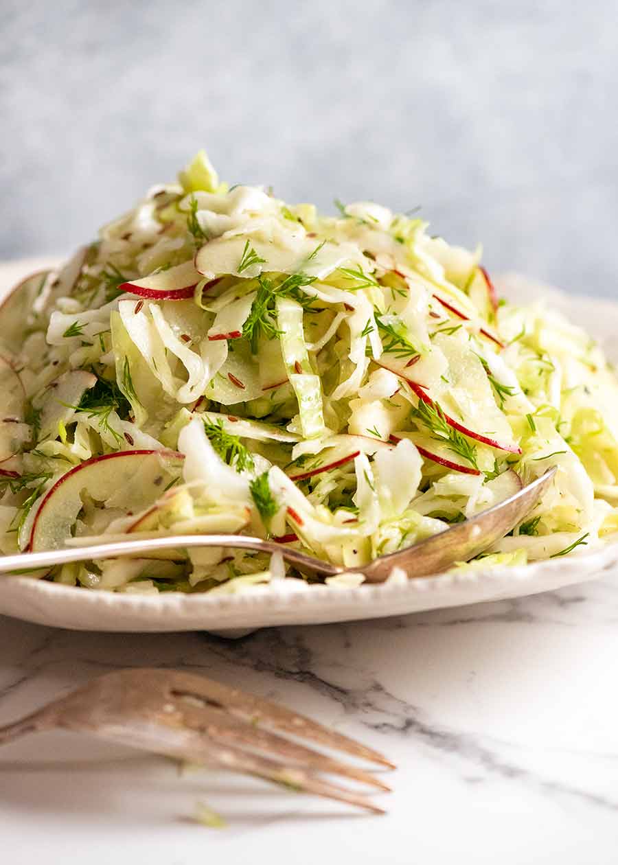 Plate piled high with No Mayo Coleslaw (Apple Slaw)