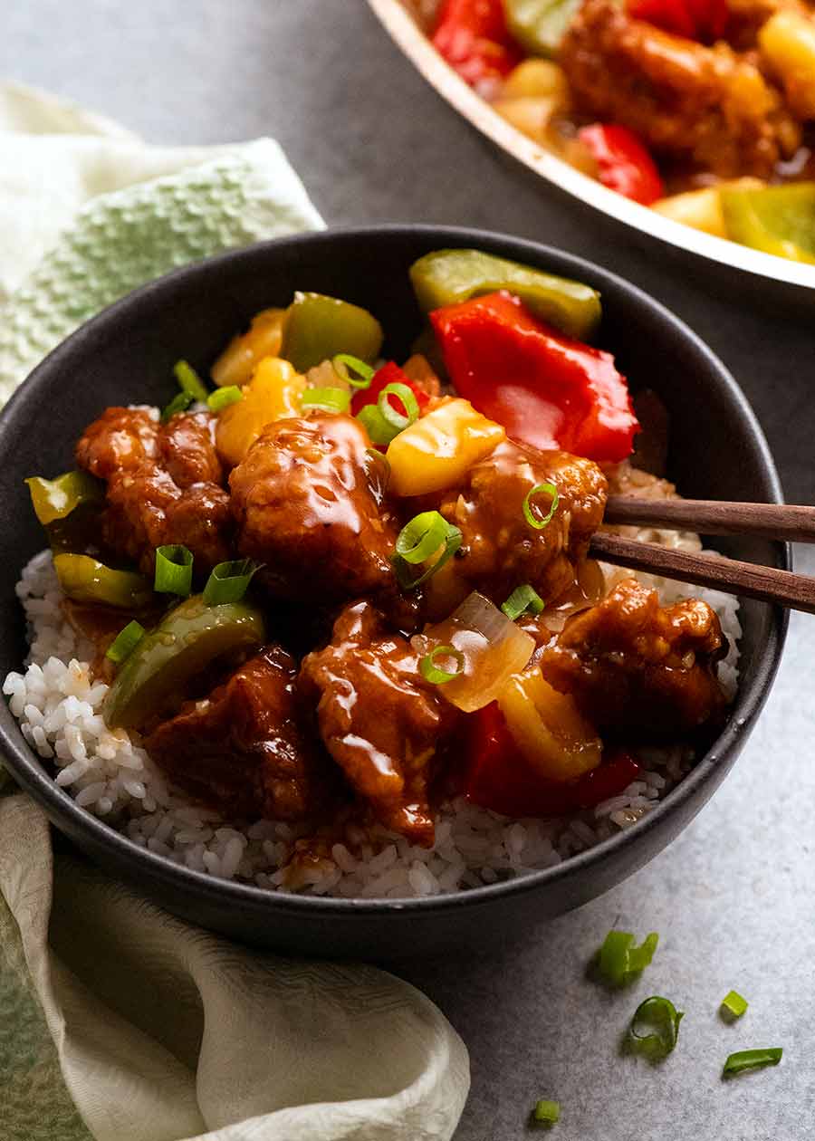 Sweet and Sour Pork in a bowl, ready to be eaten