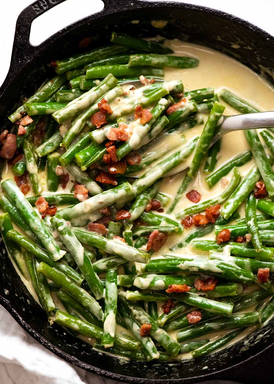 Overhead photo of Green beans in creamy parmesan sauce with bacon