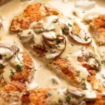 Chicken in Creamy Mushroom sauce in a skillet, ready to be served