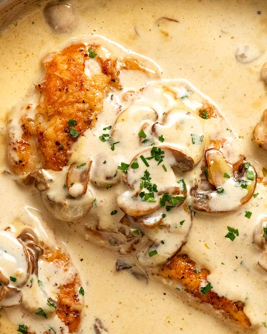 Close up of Chicken Breast in Creamy Mushroom sauce in a skillet, fresh off the stove