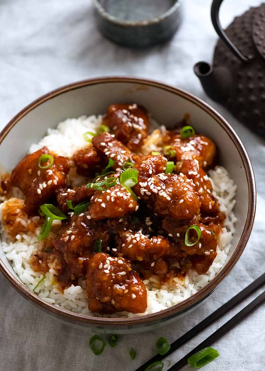General Tso's Chicken served over white rice with Chinese tea on the side