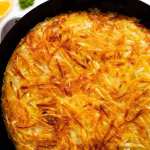 Close up of freshly cooked Potato Rosti in a skillet, fresh off the stove