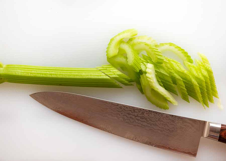 Finely slicing celery for Celery Salad