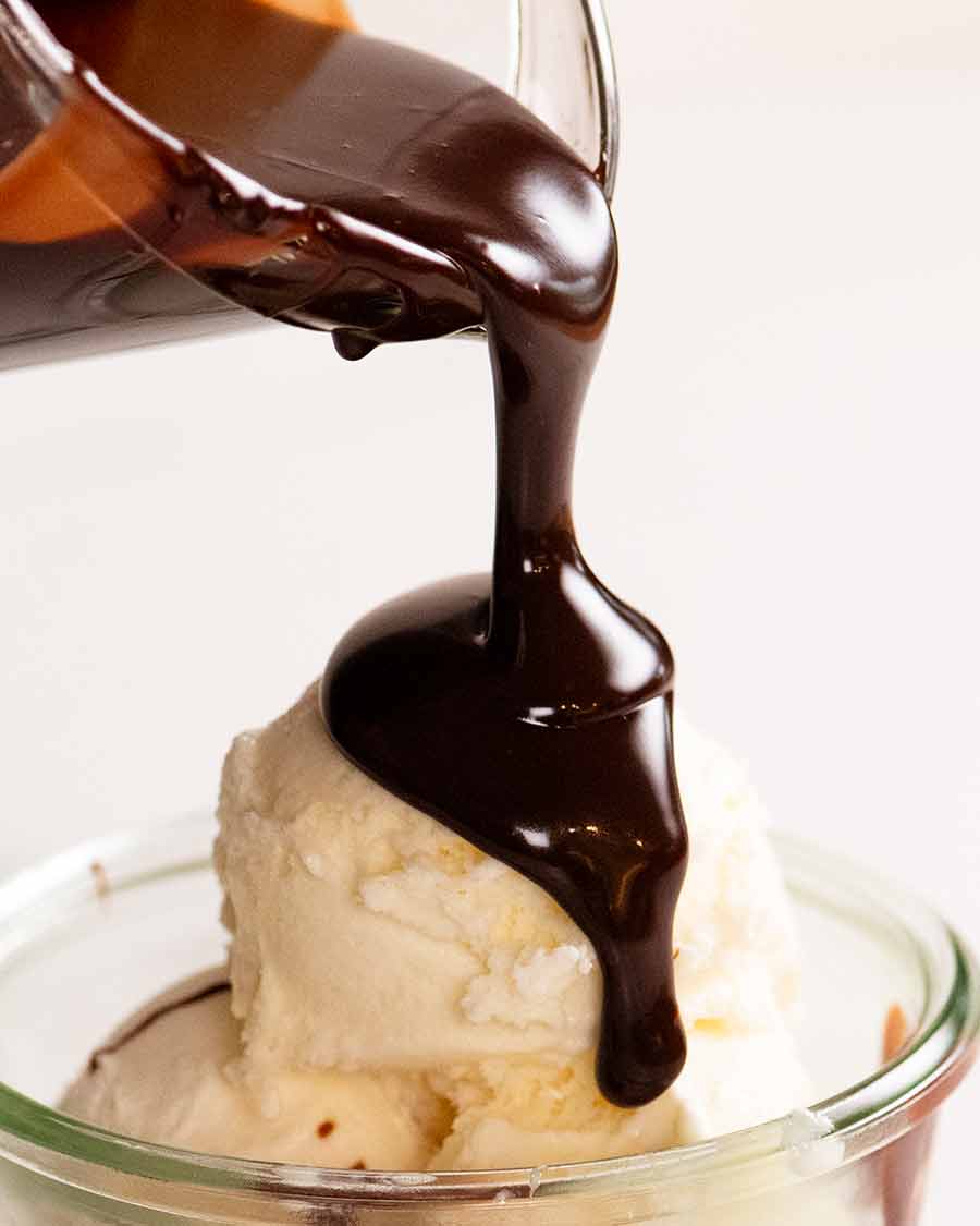 Pouring Hot Fudge Sauce Chocolate ganache over ice cream