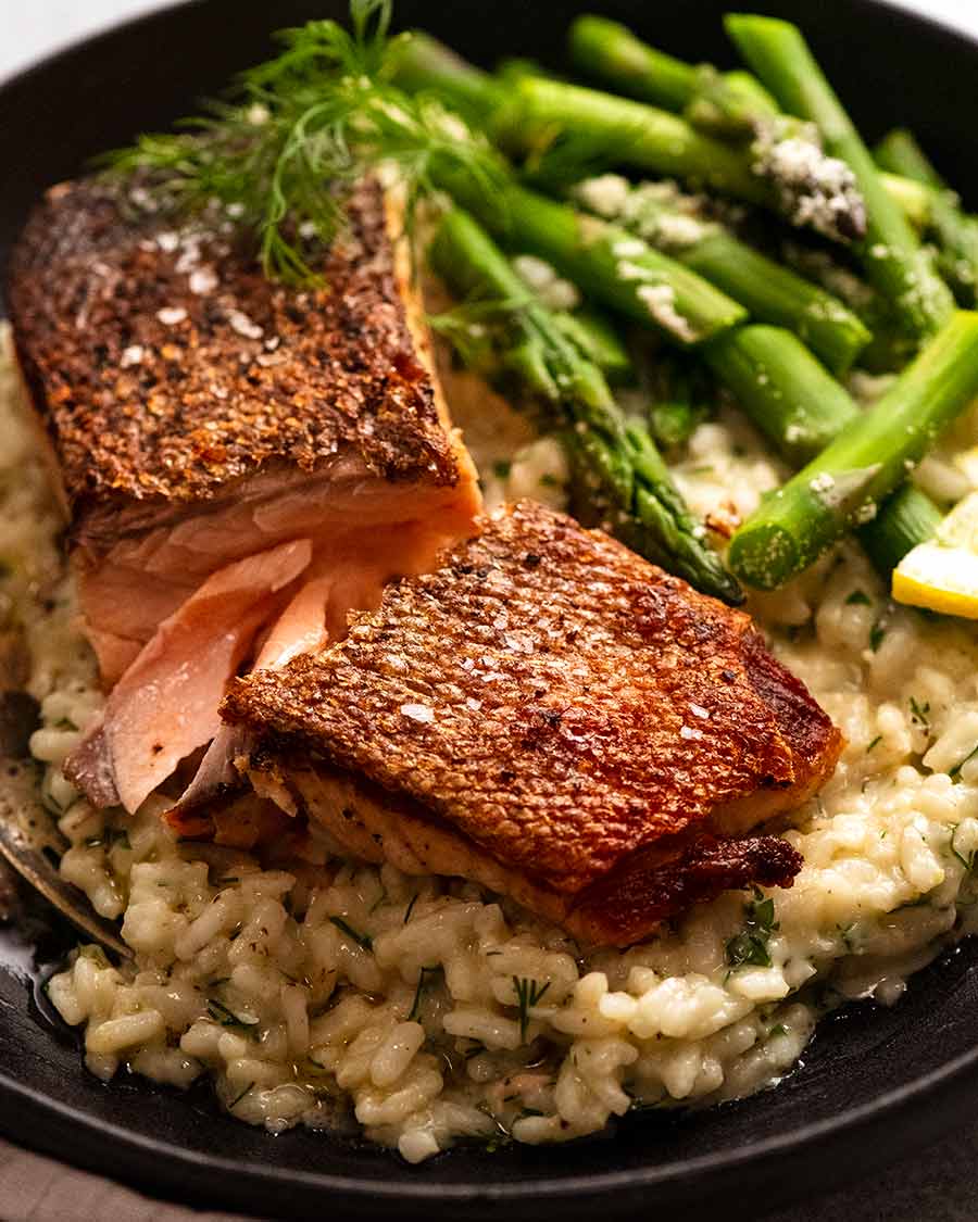 Plate of creamy risotto with crispy salmon