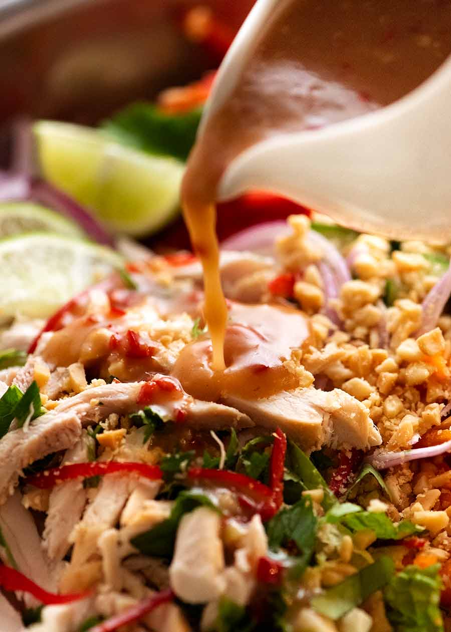 Pouring Vietnamese Dressing over Vietnamese Chicken Salad