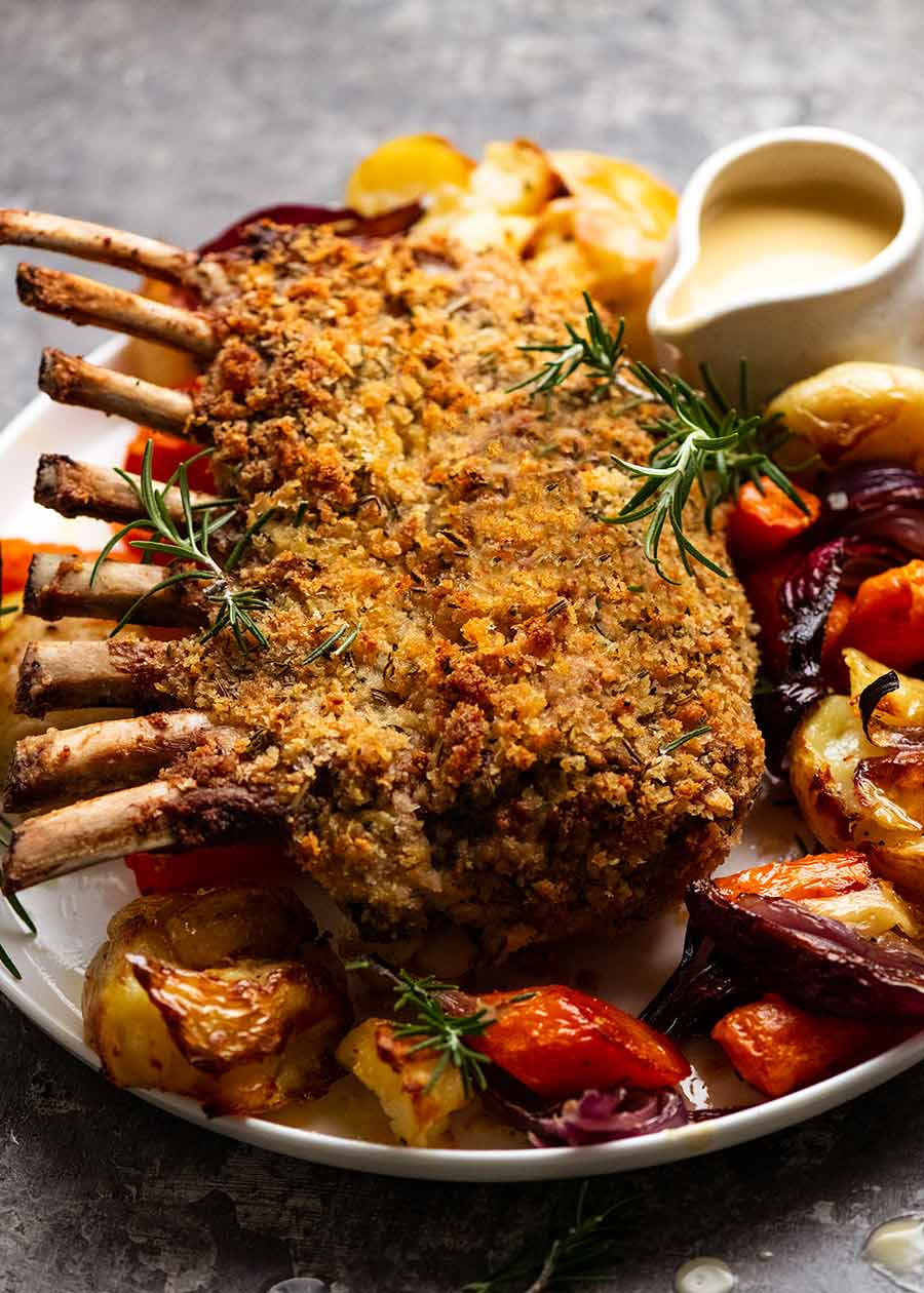 Rosemary Crumbed Rack of Lamb on a plate with roasted vegetables