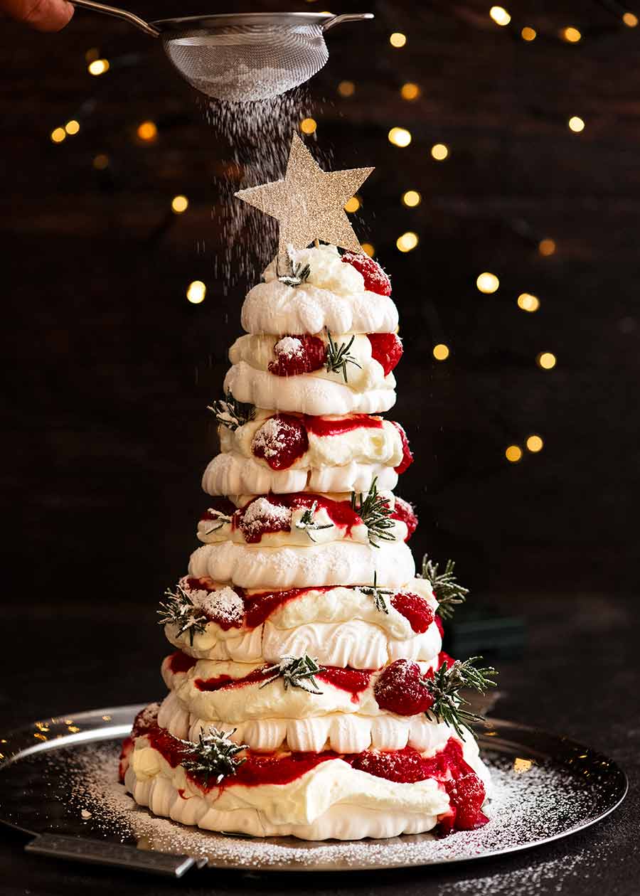 Pavlova Christmas tree dessert dust with powdered sugar