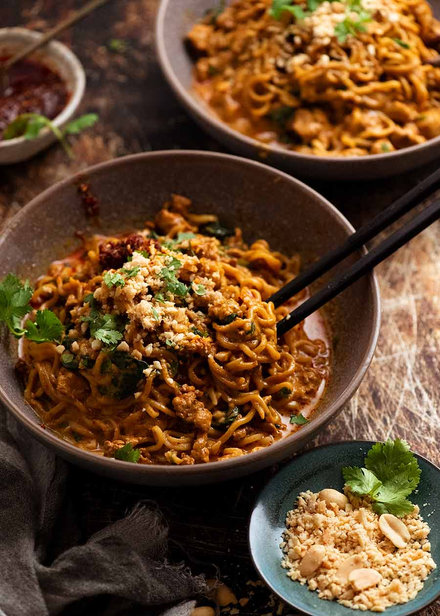 Thai chicken peanut noodles in a bowl, ready to eat