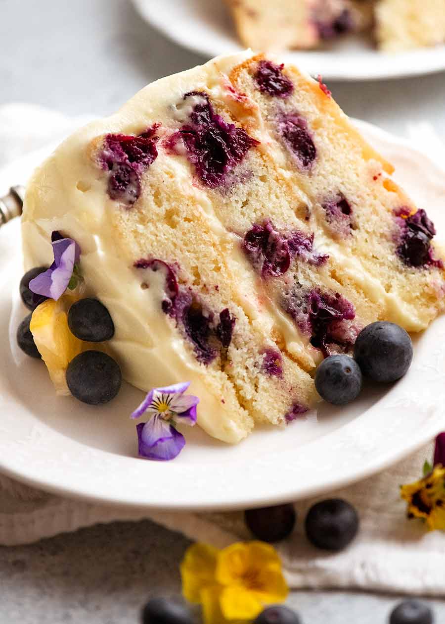 Slice of Blueberry Cake with Lemon Cream Cheese Frosting on a plate