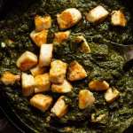 Freshly cooked Palak Paneer in a skillet, ready to be served