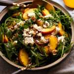 Peach Salad with Poppyseed Dressing in a bowl, ready to be served