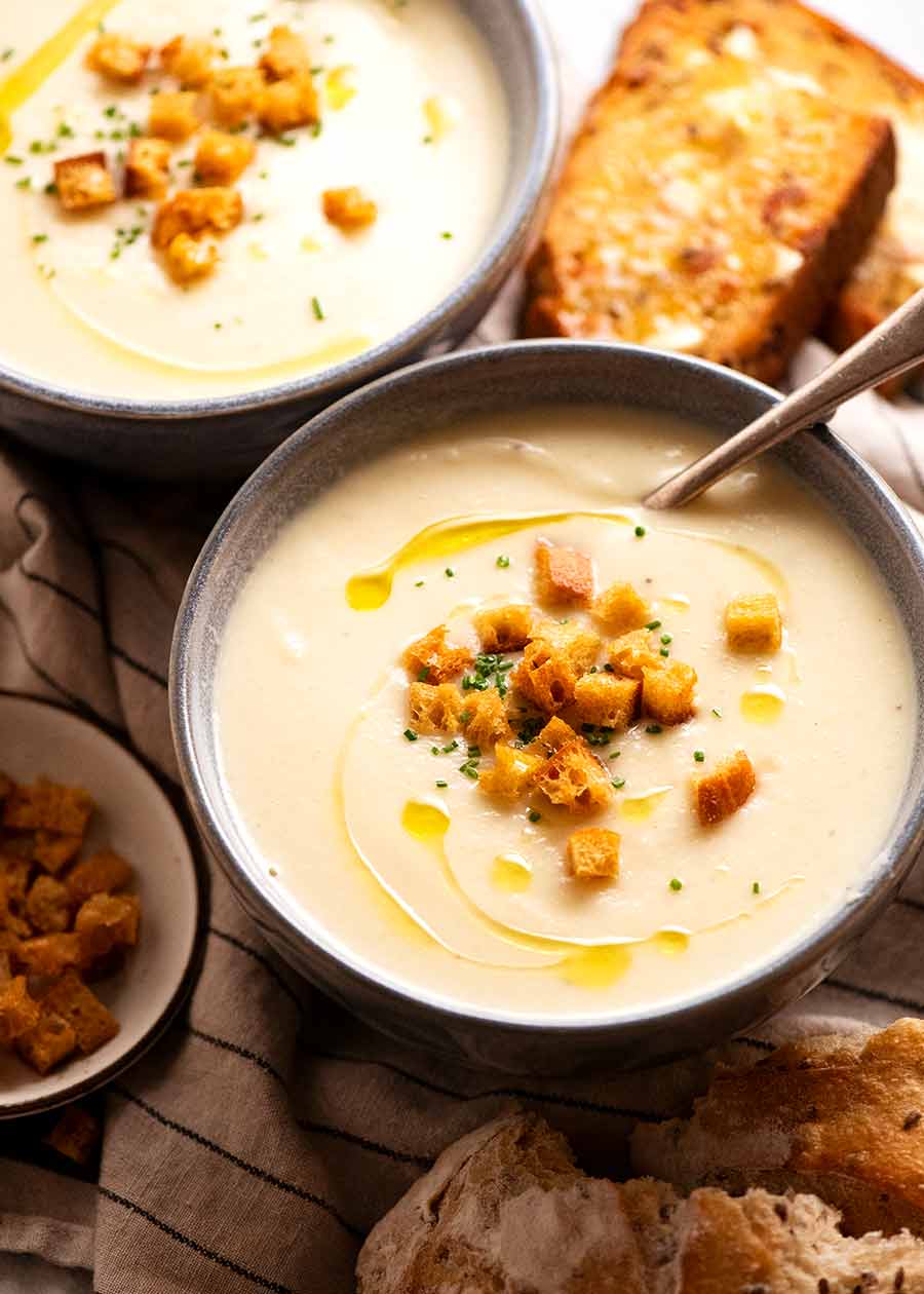 Celeriac Soup in bowls with crusty bread on the side for dunking