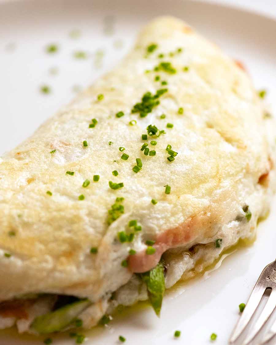 Fluffy Egg White Omelette on a plate stuffed with Asparagus and Prosciutto