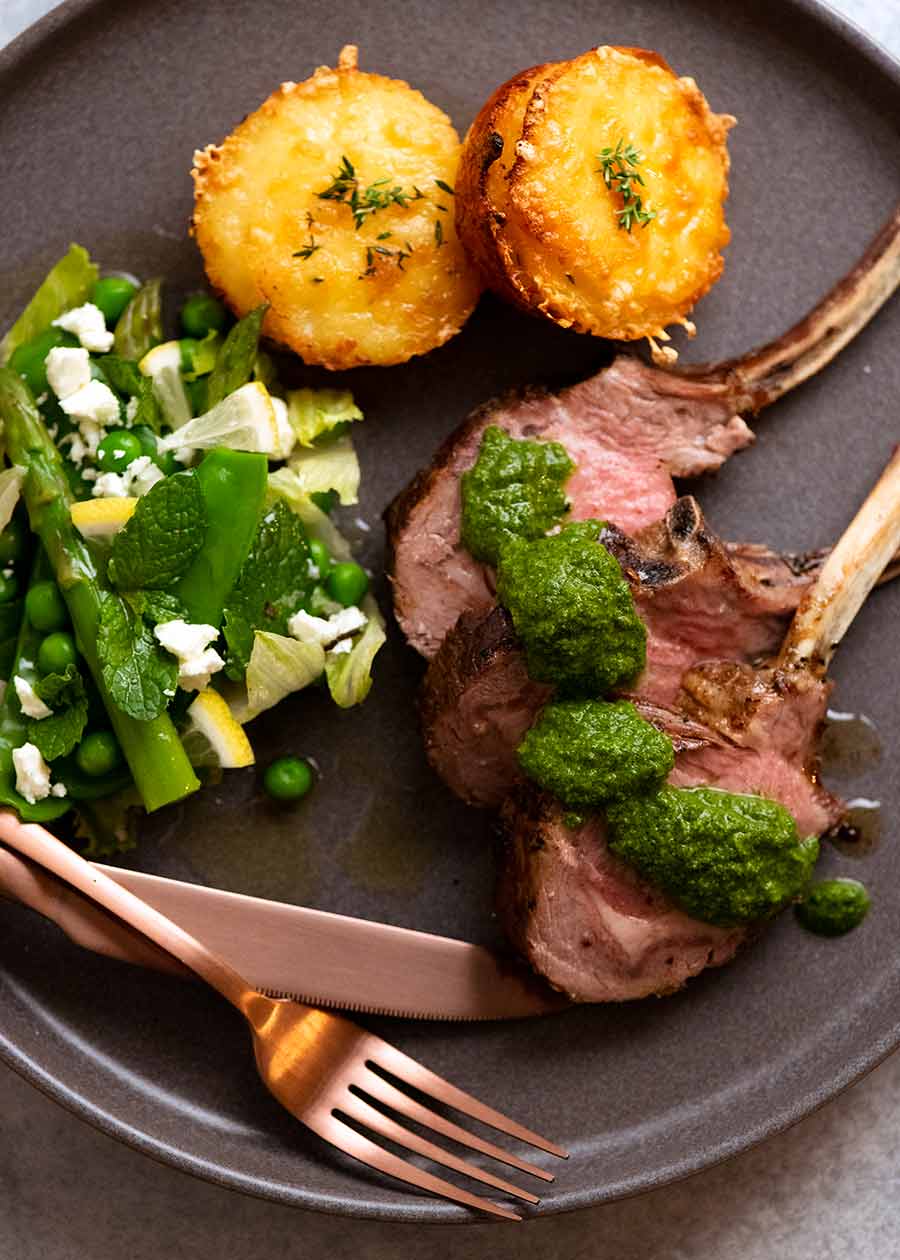 Rack of Lamb cutlets on a plate with salsa verde sauce