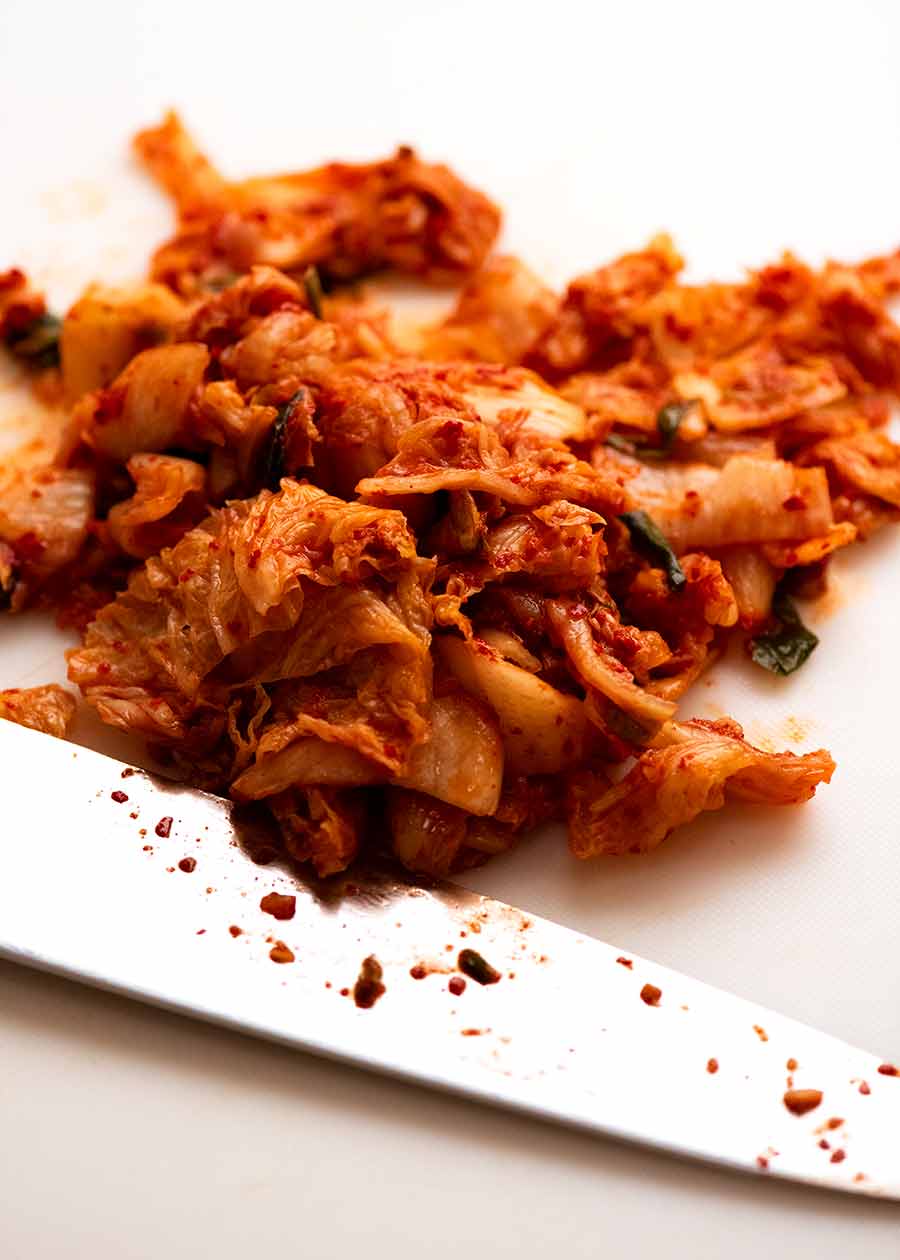 Chopped kimchi on cutting board for Kimchi Fried Rice