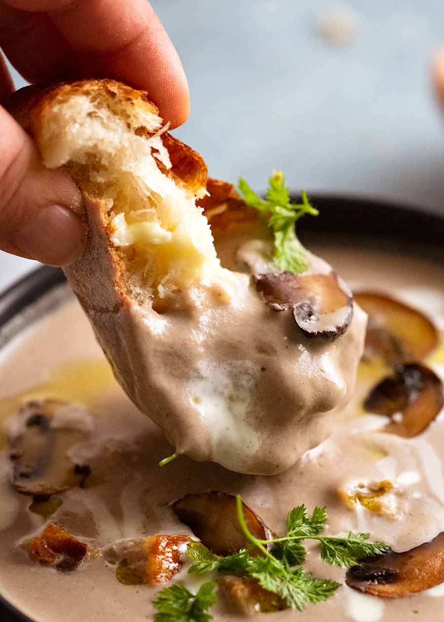 Dunking bread into Mushroom Soup