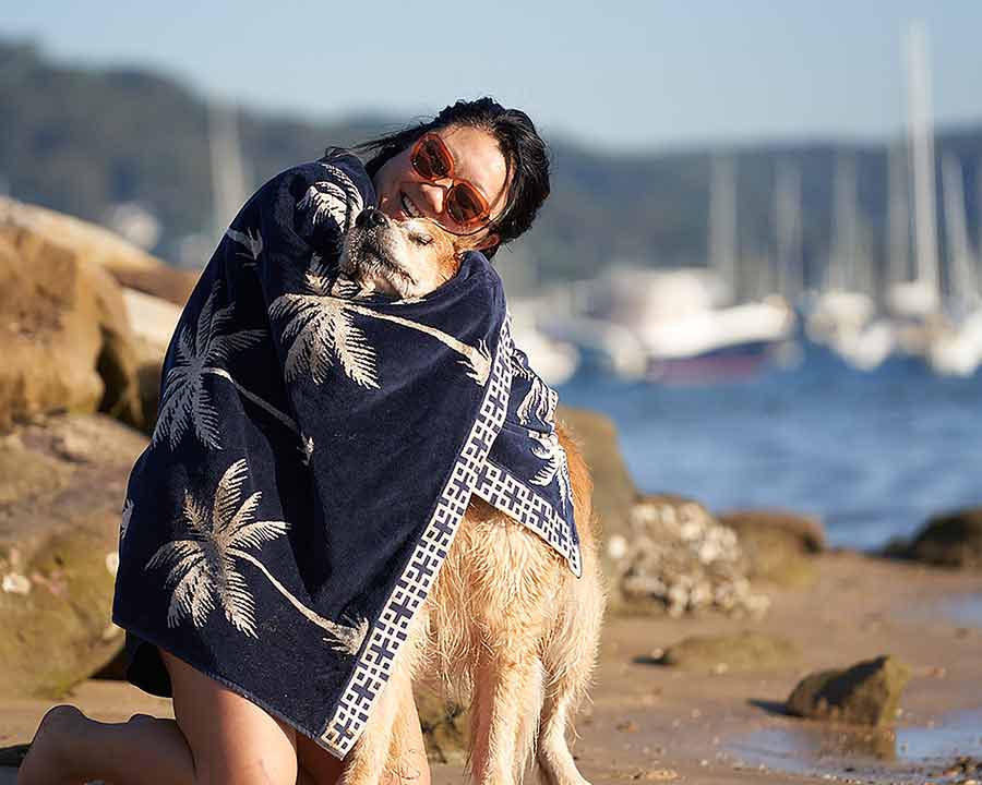 Nagi hugging Dozer with beach towel
