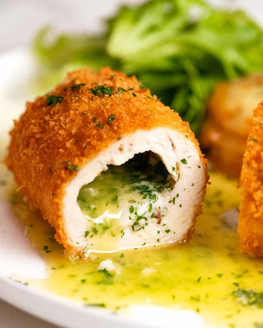Close up photo showing Chicken Kiev stuffed with garlic butter