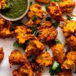Fresh cooked Pakora with Coriander Mint dipping sauce