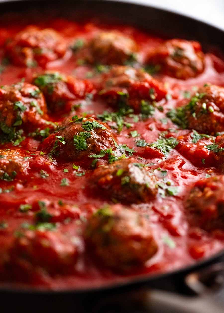 Skillet with simmering Mexican Meatballs