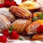Close up of freshly made Madeleines dusted with icing sugar
