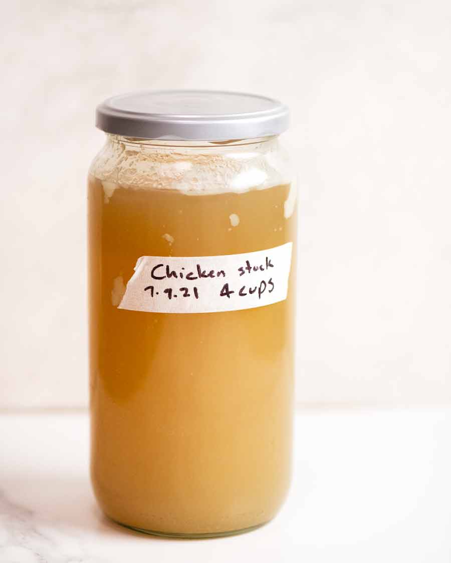 Jar of cold Homemade chicken stock