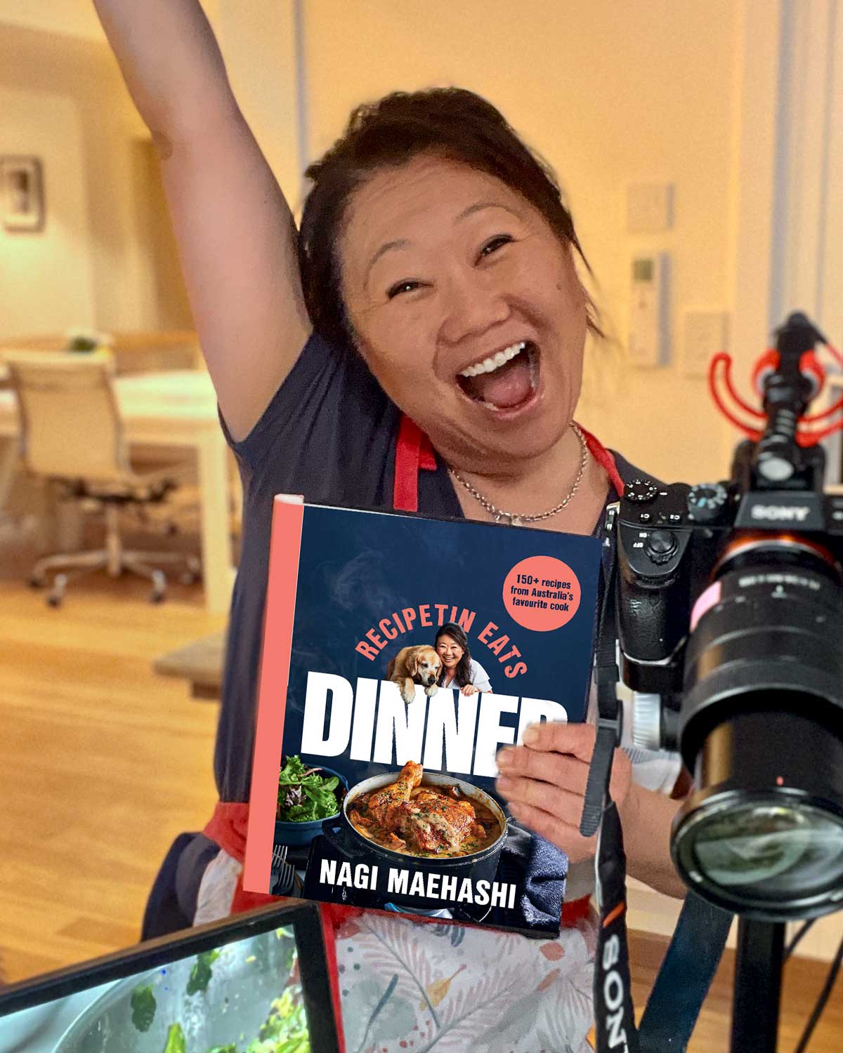 Nagi Maehashi holding RecipeTin Eats Dinner cookbook