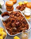 My best pulled pork in a pan with sides ready to be served