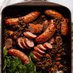 One cookware  baked sausage and lentils caller  retired  of the oven