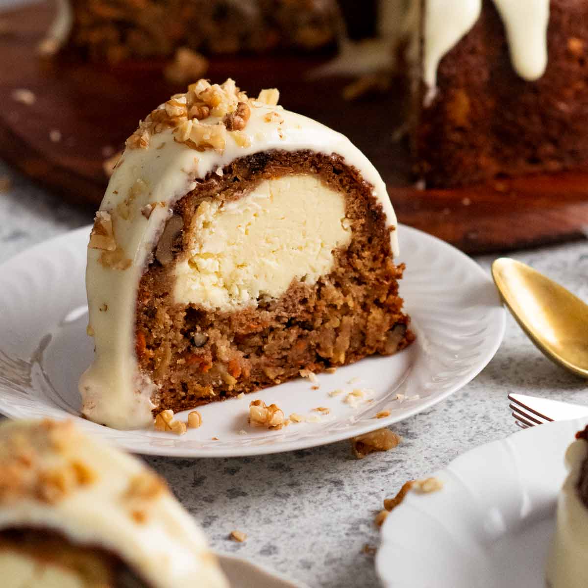https://www.recipetineats.com/wp-content/uploads/2023/04/Cheesecake-stuffed-carrot-bundt-cake-2-SQ.jpg