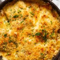 Creamy fish on potato gratin fresh out of the oven