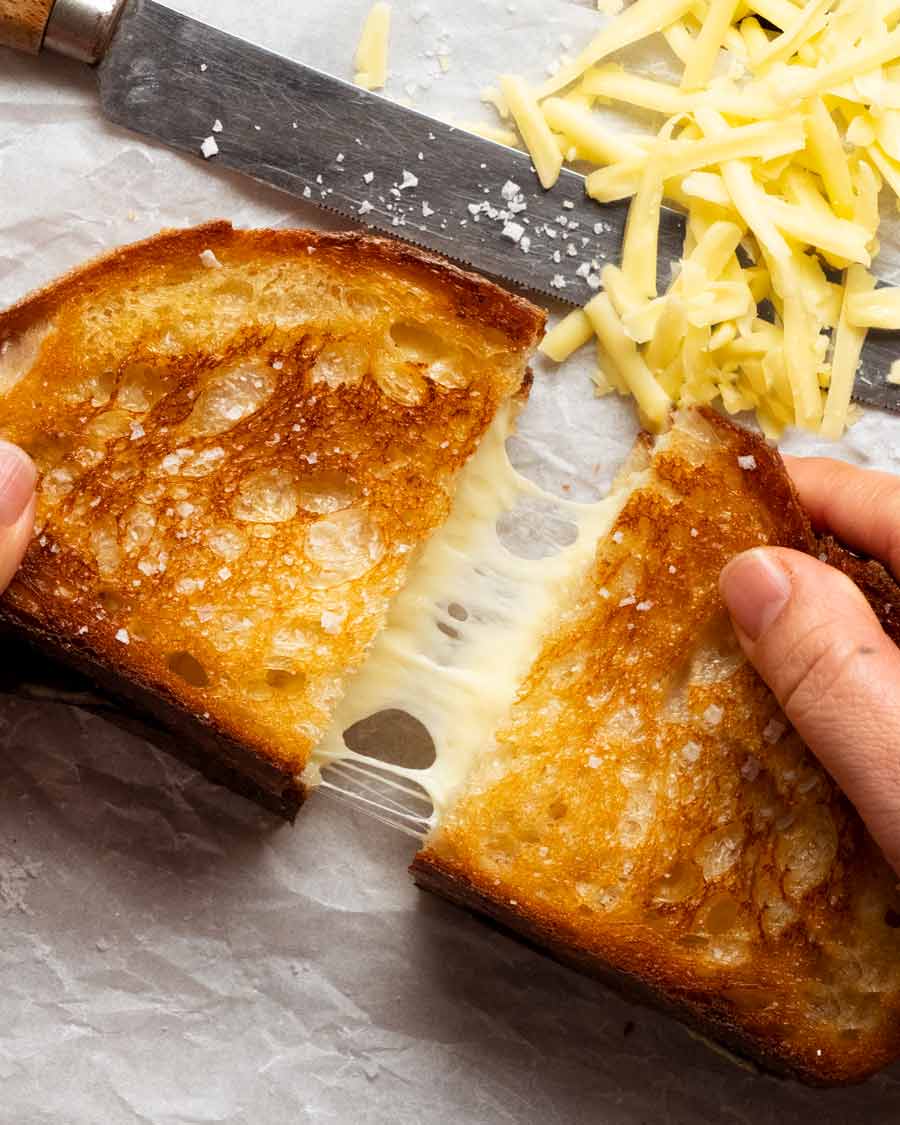 Grilled cheese- ultimate cheese toastie - cheese pull shot
